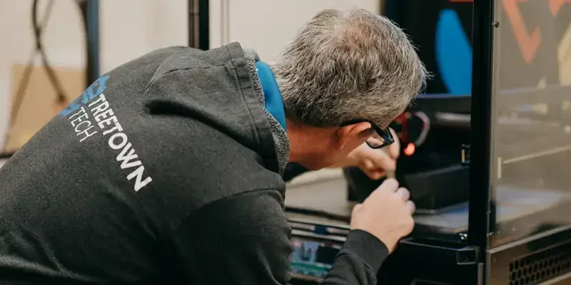 Treetown Tech employee working on product